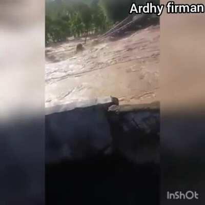 Raging Bone River in Indonesia washes away a bridge - 6/11/2020