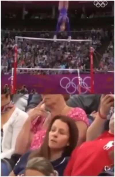 Parents watching their daughter at the Olympics