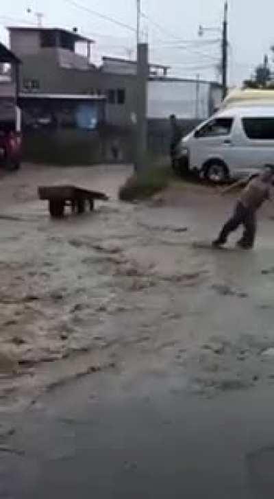 Walking up a flooded street