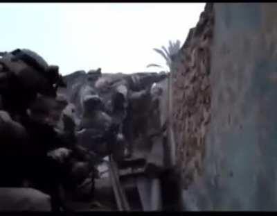 US Soldiers from 1-36th Infantry sling lead from a rooftop in Hit, Iraq.