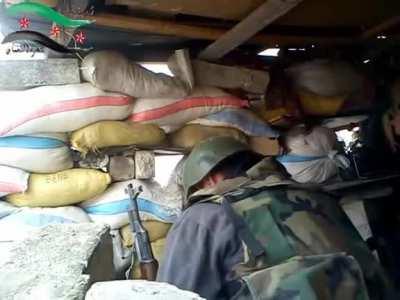 Syrian Army soldiers man a sandbagged position during fighting with the FSA for control of Maarat al-Numan - 2012