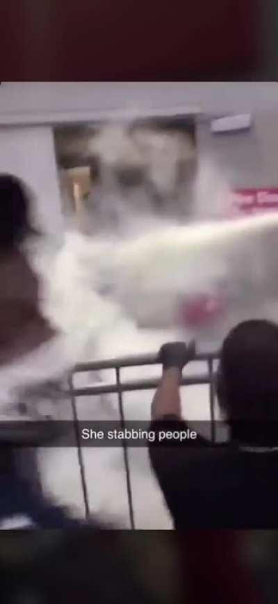 Crazy lady on wheelchair stabbing random people at Target following looters