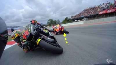 Bezzecchi adjusting his front-brake during the sprint race while at 60 degrees lean