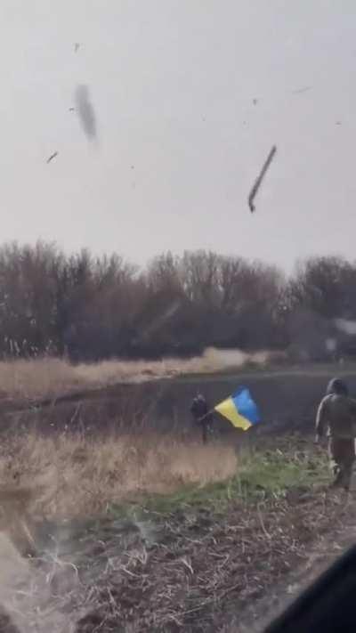 This boy always met flying helicopters with a flag, one day they landed in front of his house.