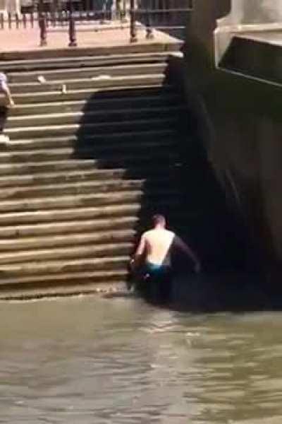 Man slips and slides down stairs into water