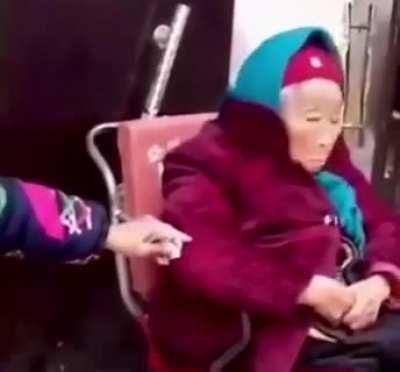 107-year-old mother gives her 84-year-old daughter candy.