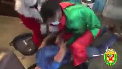 In a yearly tradition Peru police dresses up as santa and his elf and enter on a drug seller house to arrest them.