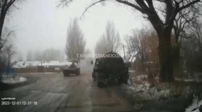 Russian BMP looses control and drives over a civilian car 