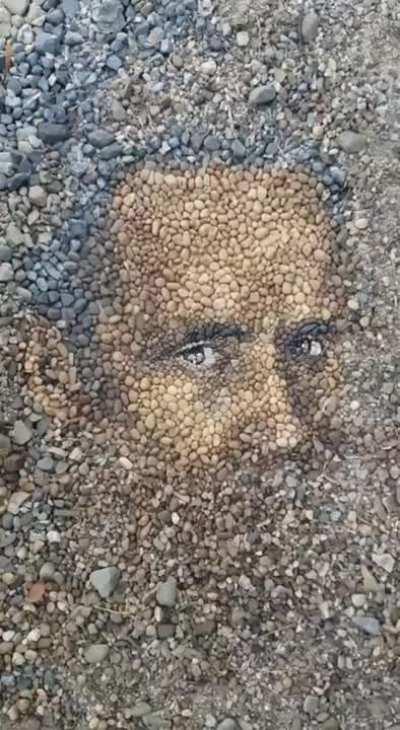 Portrait made out of stones.