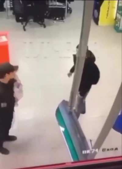 Man sucker punches security guard and gets eliminated with a lethal spinning kick...