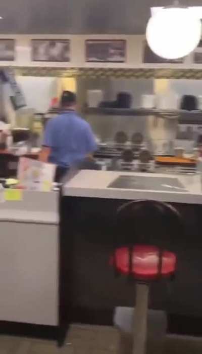 Chair catch by a Waffle House employee