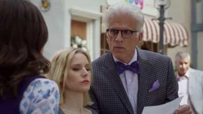 S01E06 of The Good Place. A prop passed to Janet is accidentally shown in frame and makes it to the aired episode.