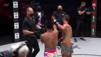 Rodtang helping opponent with a cut after brutal fight