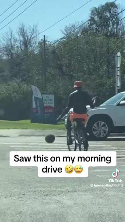 Dribbling two basketballs while riding a bike