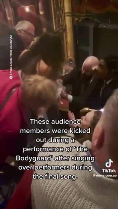 Audience members get dragged out after singing at the top of their lungs during a Theater Performance