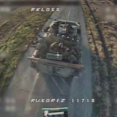Ukrainian FPV drone’s terminal dive onto a Russian BMP-2 with infantry add-on armor