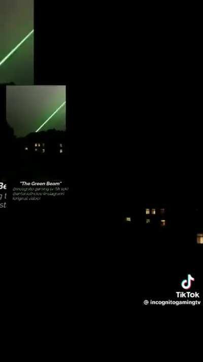 Panicked guy films green laser coming from the sky