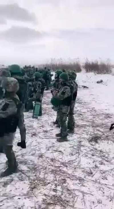 Ukrainian soldiers listen to the explosions in Avdiivka (before getting sent there, probably)