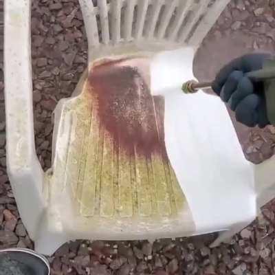 Cleaning a dirty chair with water