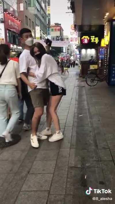 This girl makes tiktok videos of her forcibly hugging, touching or trapping Korean men. This is not okay behaviour. In all videos the men are visibly uncomfortable and try to get away from her, she either follows them or will not let go of them...if the r