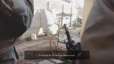 Ukrainian soldiers use an automatic grenade launcher as a mortar near Donetsk Airport.