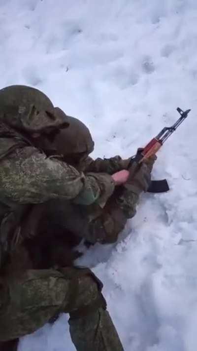 Brandon herrara teaching his son how to load and fire an ak