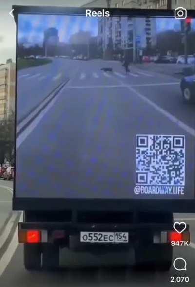 This truck displays its view on the back to help drivers.