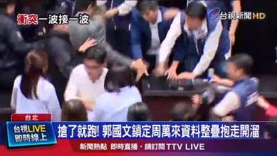 Taiwanese Parliament member reportedly stole a bill and ran away with it to stop it from being passed