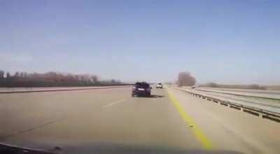 Changing tire in the middle of highway