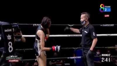 Muay Thai fighter uses 8 count to pop her arm back into the socket . . . and is good to go!