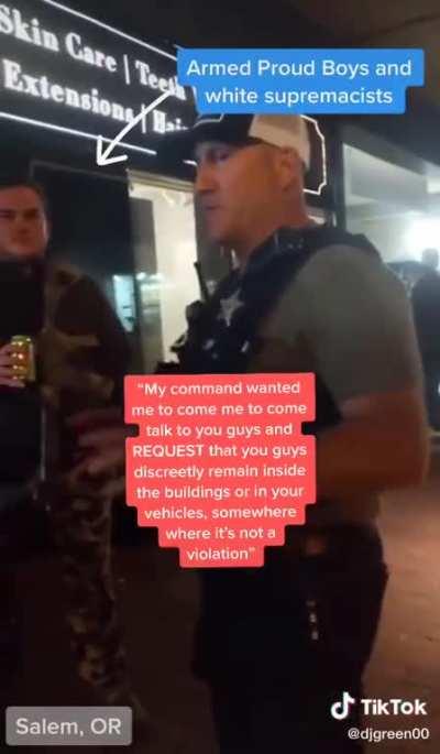 POLICE OFFICER TELLS PROUD BOYS TO HIDE INSIDE BUILDING BECAUSE THEY'RE ABOUT TO TEAR GAS PROTESTERS. THE OFFICER SAID HE WAS WARNING THEM &quot;DISCREETLY&quot; BECAUSE HE DIDN'T WANT PROTESTERS TO SEE POLICE &quot;PLAY FAVORITES.&quot;