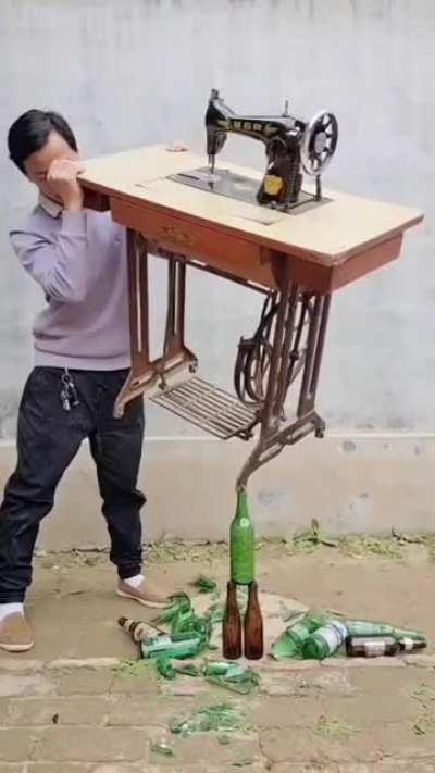 Balancing sewing machine table on stacked bottles