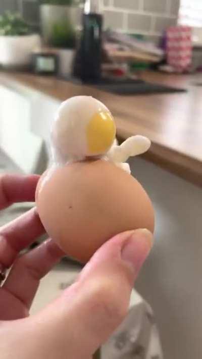 This boiled egg that came out looking like an astronaut waving their arm.