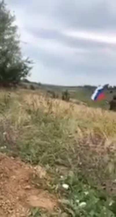 Intoxicated Russian trooper heads out into battles with a flag and a rifle, he is eliminated by Ukrainian return fire.