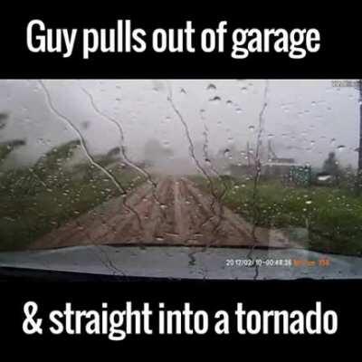 Guy pulls out of garage &amp;amp; straight into a tornado