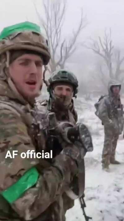 Ukrainian troops board their M113 APC and move out amidst falling snow. A M240 is mounted on the M113.