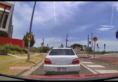 Driver randomly stops in intersection.