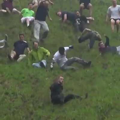 Footage from the 2018 Gloucester Cheese-Rolling Race (in which people chase a 70mph wheel of cheese down a 1:2 gradient hill).