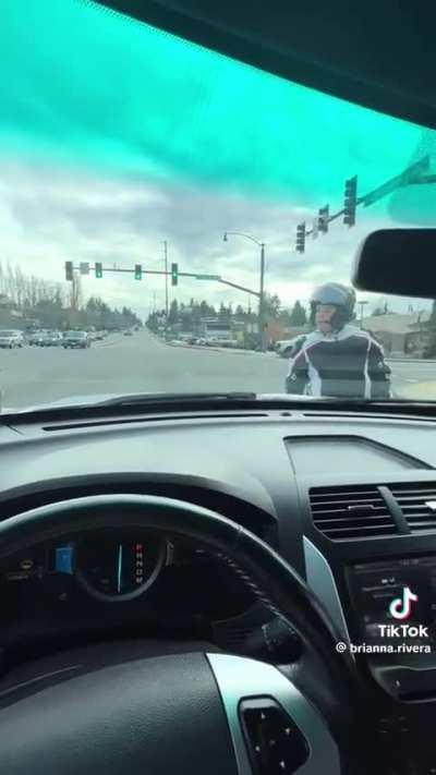 Man starts confrontation at stoplight with biker, then pulls a gun