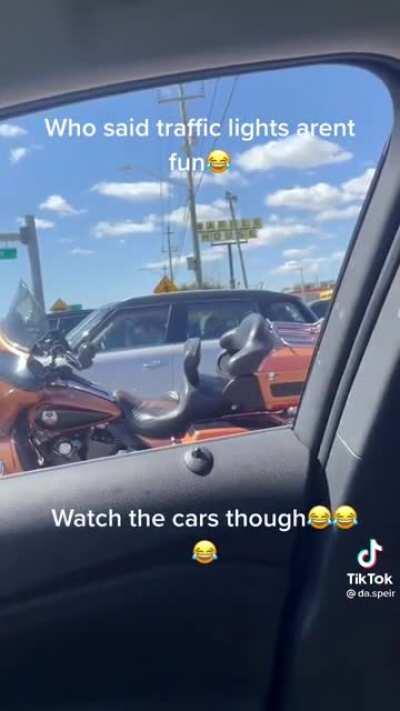 A Biker lifts up the mood in traffic