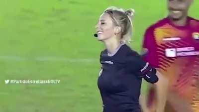 Soccer referee Fernanda Colombo yellow card psyche-out.