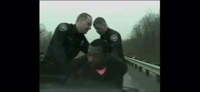 Suspect eats evidence after being placed on the hood of the police car. His smirk says it all.