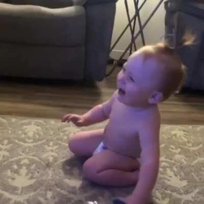 Toddler's reaction to nailing the bottle flip.