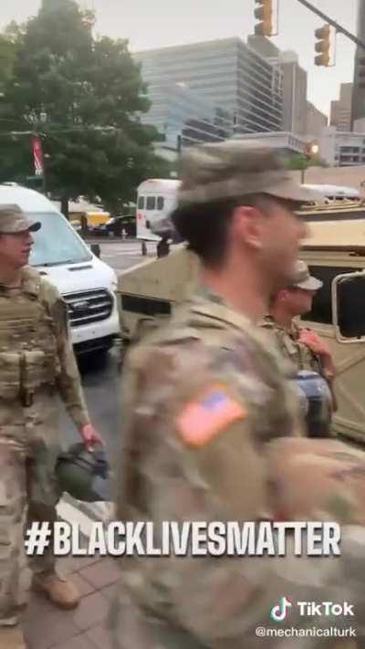 National guard dancing with protesters