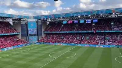 Denmark and Finland fans chant Christian Eriksen's name together after the game was suspended