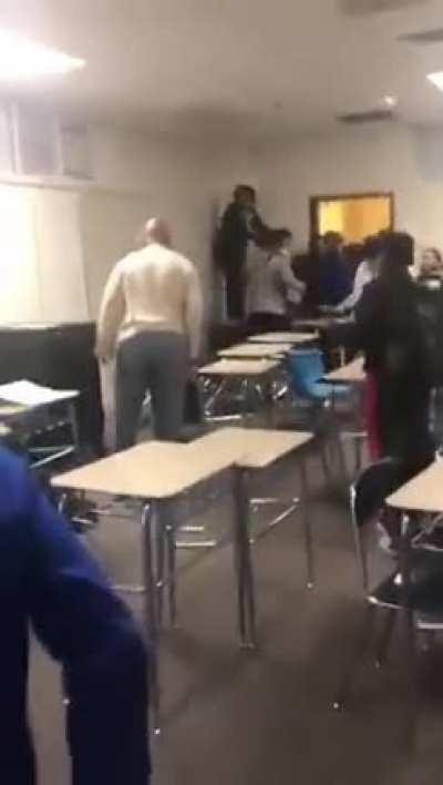 Teacher snaps after a chair is thrown at him. This is a middle school.