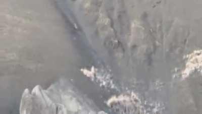 this shot of a snow leopard hunting mountain goat