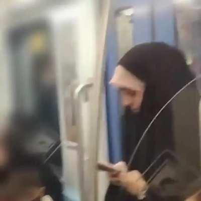 Mashhad subway. Today, I was on the train when a woman wearing a chador began recording and photographing me. And when people tried to seize her phone to delete the video she shot of me, another lady rushed to her aid, pushed her from the train station to