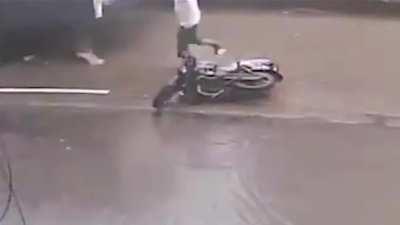 Bike Skids In Water, Woman Run Over By Bus