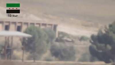 FSA 13th Division BGM-71 TOW team hits an SAA BMP in the rear - Siege of Wadi Deif - 8/9/2014